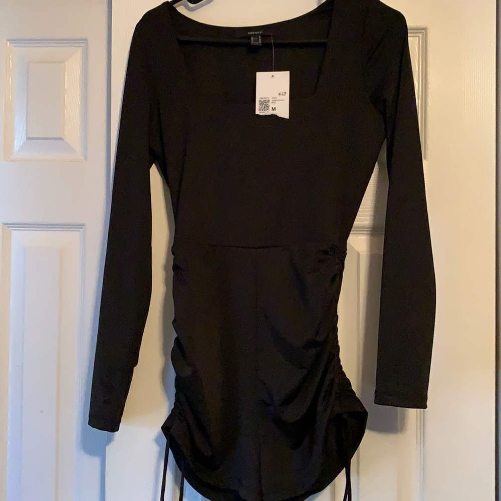 Black romper shorts with ties on the side.